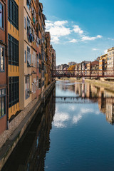 Girona landmark in Catalonia. Urban scene of river facade houses and water reflection