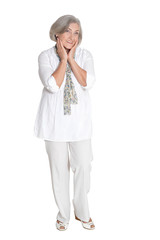 Happy senior woman posing on white background