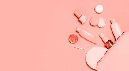 Living Coral decorative cosmetic on pink background.