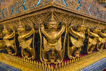 Fototapeta na wymiar Wat Phra Kaeo, Temple of the Emerald Buddha and the home of the Thai King. Wat Phra Kaeo is one of Bangkok's most famous tourist sites and it was built in 1782 at Bangkok, Thailand.