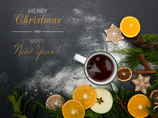 Obraz na płótnie Canvas christmas background with tea or punch and cookies, oranges and other christmas items