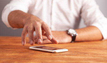 businessman phone wooden background