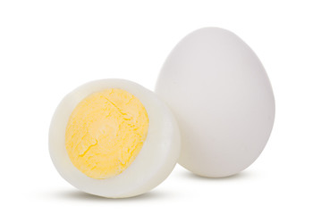 Two boiled whole and sliced eggs isolated on white background