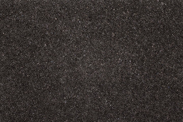 Black foam texture board. Soft rubber material background.