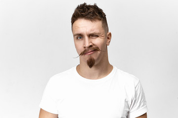 Human facial expressions and non verbal communication. Attractive fashionable young hipster with...