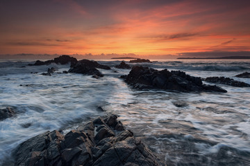 Sea sunrise, near the rocks