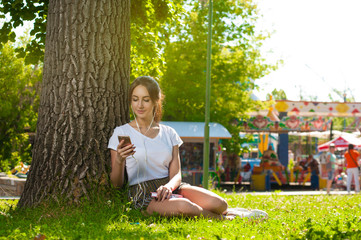 Attractive student girl in Park Outdoors.