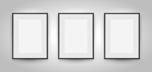 Three realistic empty rectangular black frames with passepartout on gray background, border for your creative project, mock-up sample, picture on the wall, vector design object