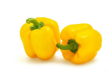 Two yellow sweet bell pepper isolated on white background cutout
