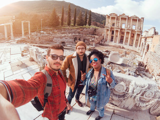 One group of traveler friends having fun in a sunny winter day in Ephesus/Efes Izmir Turkey