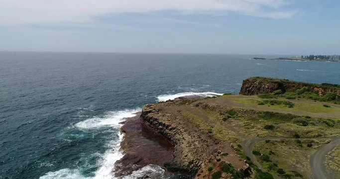 Bombo Quarry headland of Pacific coast in Australia near Kiama town with geological hexagonal basalt rock formations.
