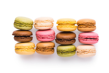 Assortment of macarons isolated over white background, top view