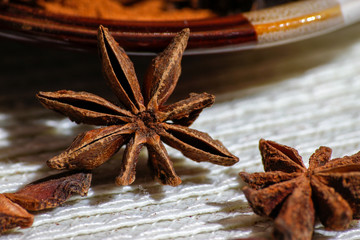 Anise stars aromatic asian spices on a rustic vintage background