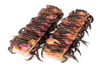 Aufgespiesste Krabben
