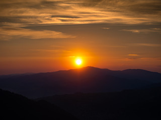 Sunset over Gorce Mountains in summer. Western Beskids and Luban Mount. View from Mount Jarmutka, Pieniny, Poland.