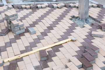 New stainless electric pole installation. Concrete stone paving flag. Public pedestrian area...