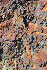 Red rocks background and texture. Geology of Las Hurdes, region of the north of Caceres province, one of the wildest areas of Extremadura, Spain