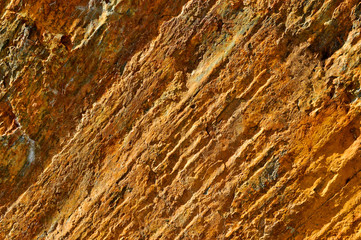 Red rocks background and texture. Geology of Las Hurdes, region of the north of Caceres province, one of the wildest areas of Extremadura, Spain