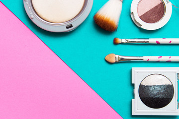 Eye shadow palette, pink and mint geometric background. Decorative cosmetics for the glamour of professional makeup. Eyeshadow colors trend.