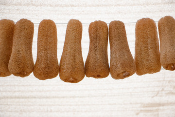 A luffa sponge is a dry plant in a kind of tropical cucumber and zucchini family. It's texture helps with skin polishing.