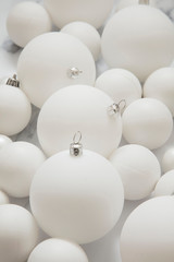 Christmas composition. white festive ball decorations on a marble background