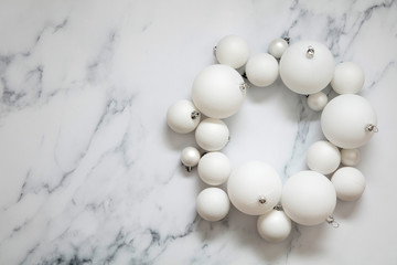 Christmas composition. white festive ball decorations on a marble background