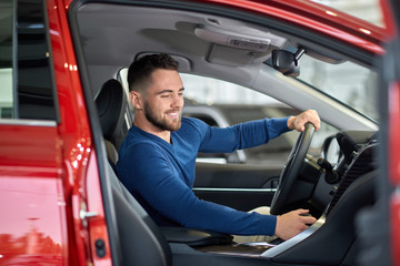 Brunette driver trying new car and changing speed.