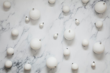Christmas composition. white festive ball decorations on a marble background