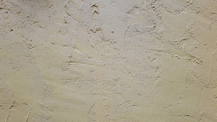 A yellow cement and concrete texture for pattern abstract background.