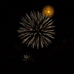 Yellow and white fireworks isolated on black background