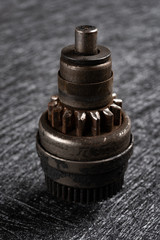 used shaft gear on dark background