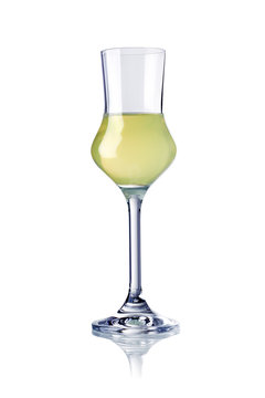 glass of limoncello liqueur isolated