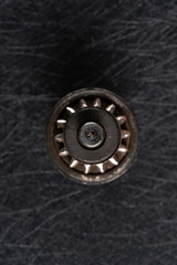 used shaft gear on dark background