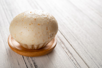 traditional Chinese bun on white wood background