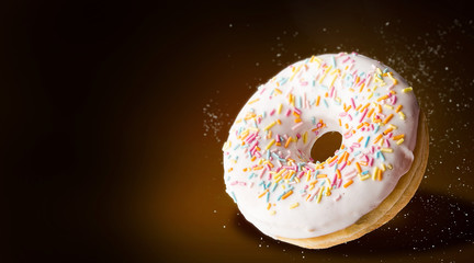 luxurious donut on a dark background with space for text