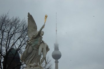View to Berlin television tower from Palace bridge with angel statue © lavinak