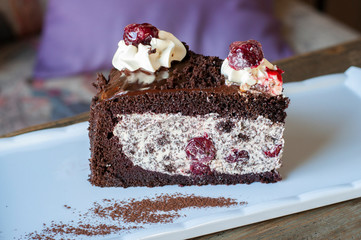 Drunk Cherry cake with chocolate and cherry mix on white plate
