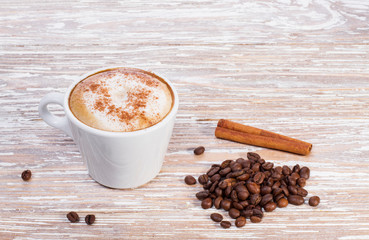 coffee cappuccino with cinnamon in white cup