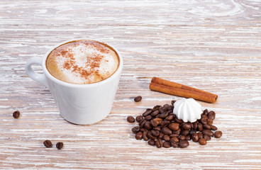coffee cappuccino with cinnamon in white cup