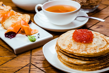 Stack of traditional russian pancakes blini. Russian food, russian kitchen