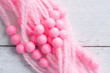 Colored plastic beads and thread