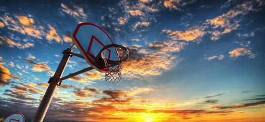 Gardinen Basketball hoop under a colorful sky in Laguna Beach © Gabriele Maltinti