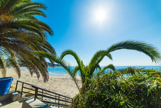 Sun shining over Laguna Beach shore in Orange County