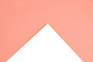 Abstract geometric paper background in Living Coral.