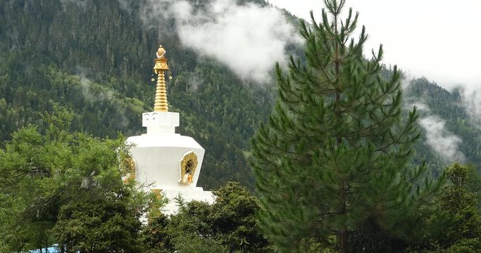 4k tibet buddhist white stupa,cloud cover mountain.