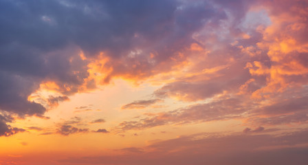 Fototapeta na wymiar Colorful vibrant dramatic sky with purple to orange clouds. Sunset time. Beautiful nature background