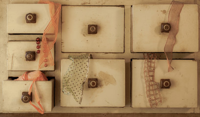 Vintage drawer with decorative ribbons