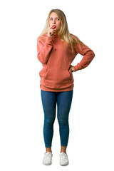 A full-length shot of a Young girl having doubts while looking up on isolated white background