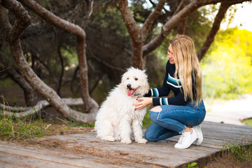 Young girl with her dog in a park