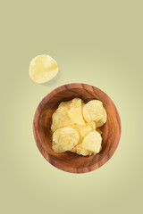 Top view of bowl with potato chips isolated